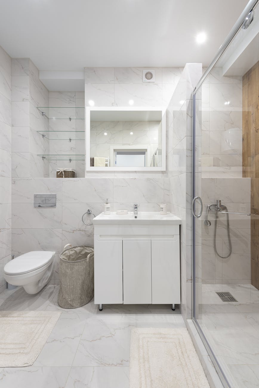 modern bathroom interior with washbasin and shower room at home